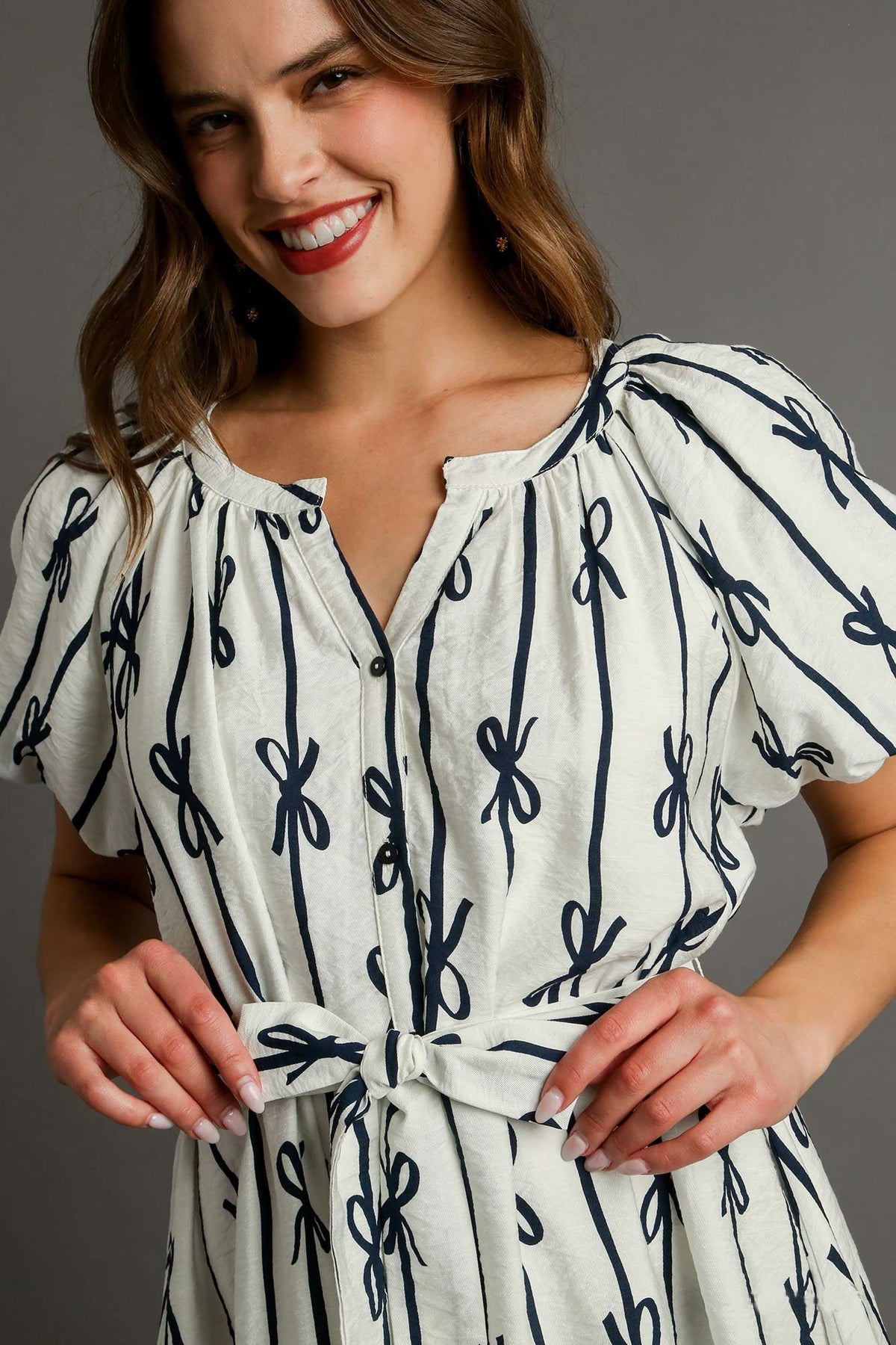 bow print flutter button down dress in off white navy-front detail