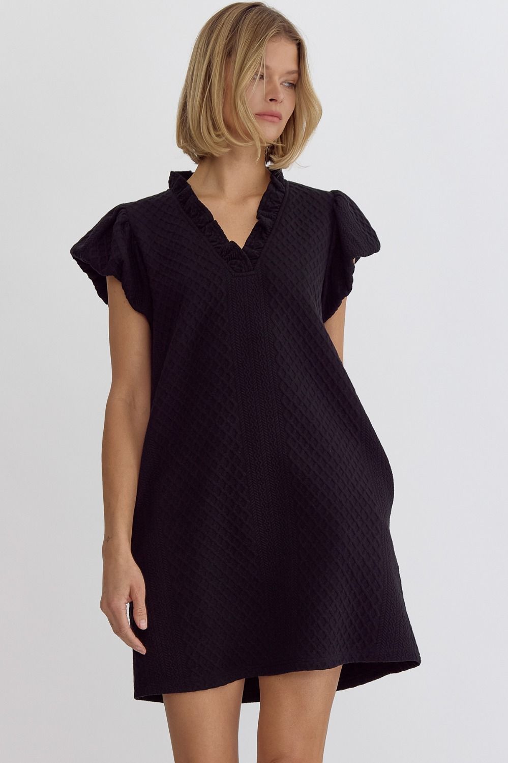 textured short bubble sleeve vneck mini dress in black-front view