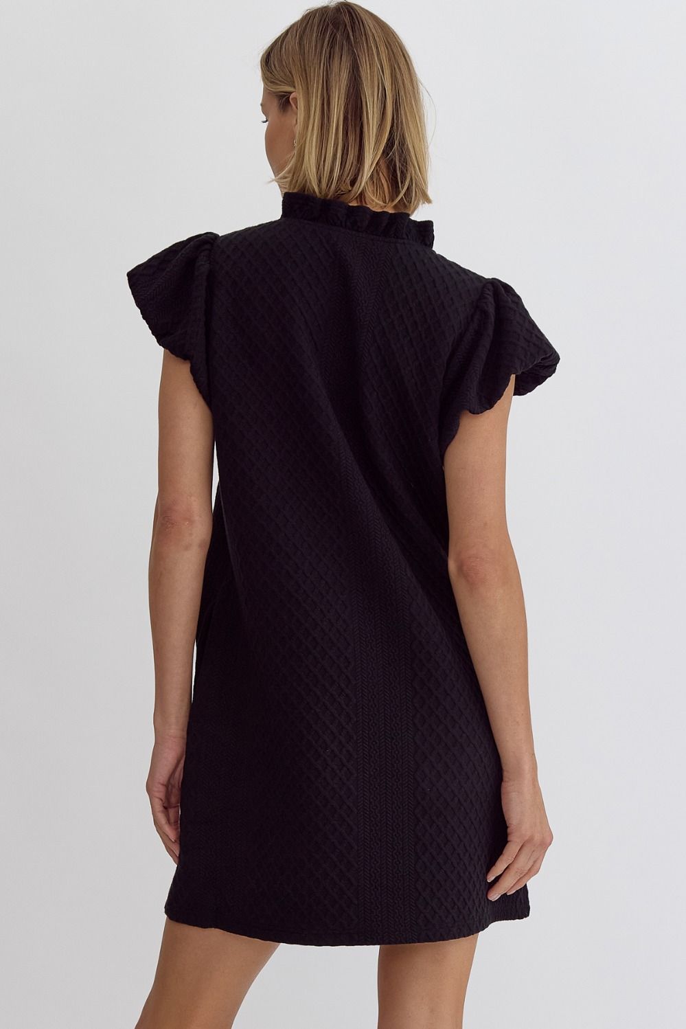 textured short bubble sleeve vneck mini dress in black-back view