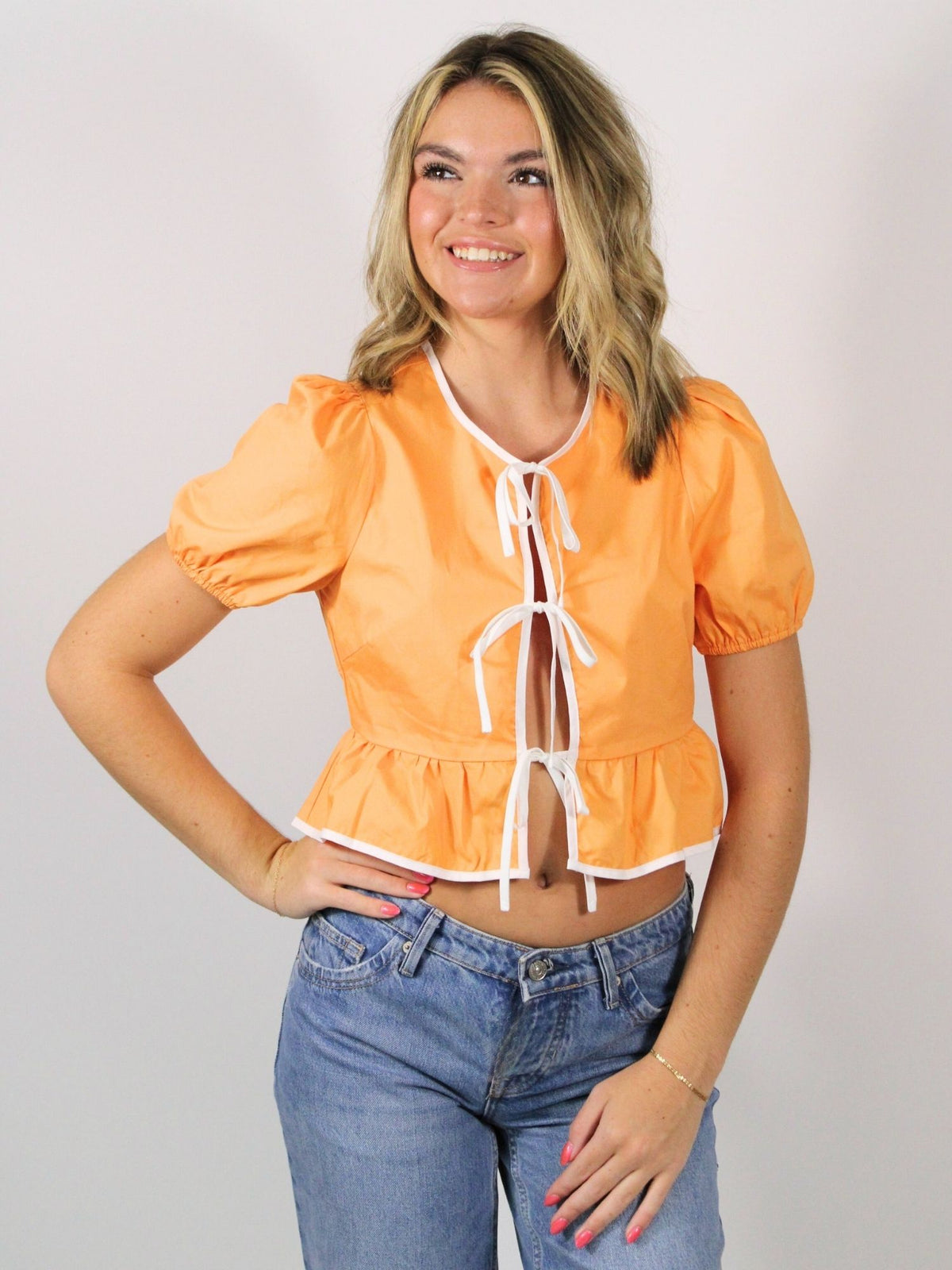 orange and white puff sleeve contrast blouse