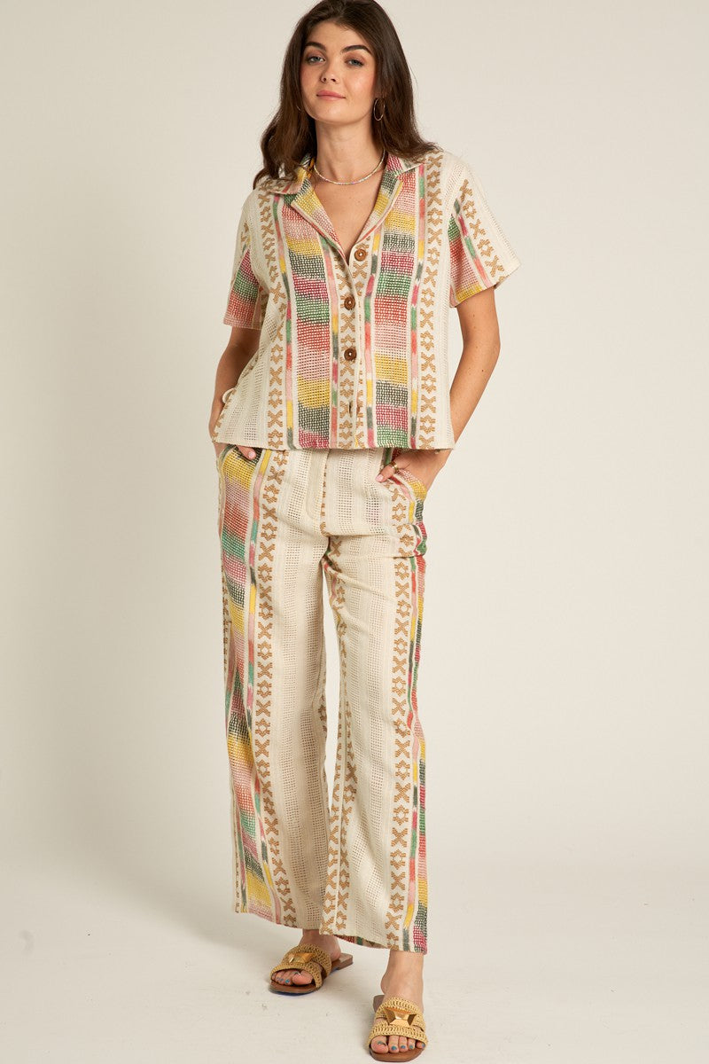 short sleeve embroidered button down shirt in cream multi color-front view with matching pants