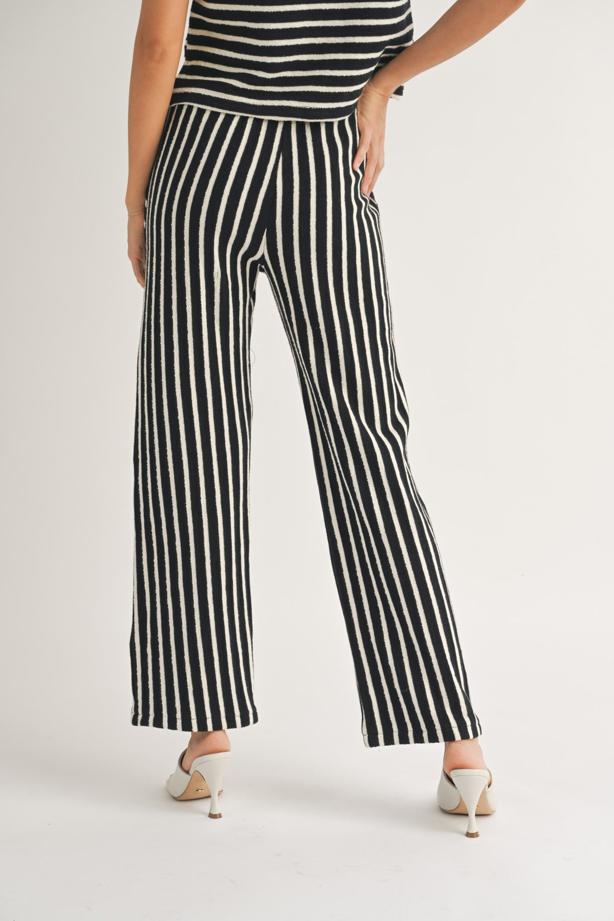 textured stripe knitted pants in black and white-back