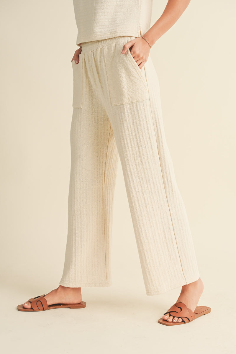 textured strip knitted pants in cream-side