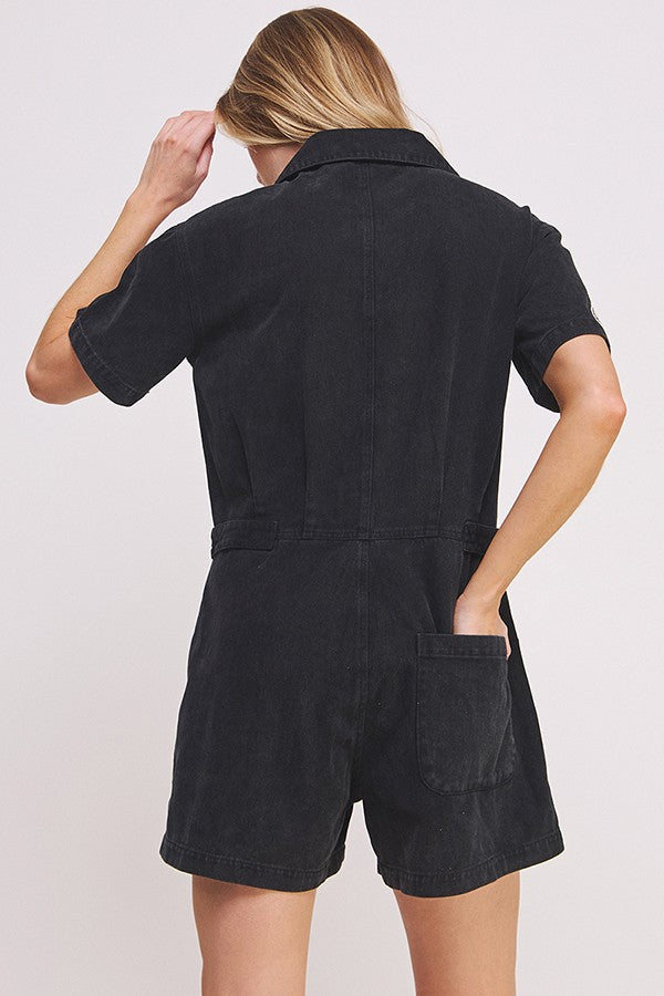 washed black short sleeve button down romper with patches-back