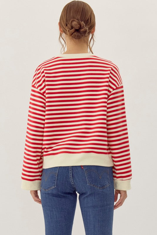 striped red and cream long sleeve top with black bows-back