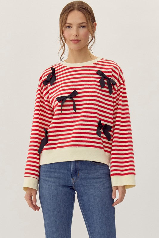 striped red and cream long sleeve top with black bows-front