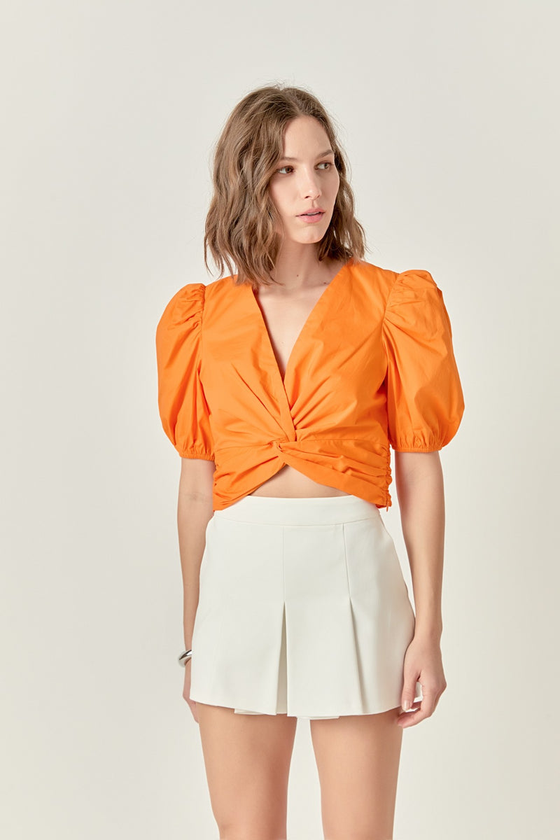 puff sleeve twist detail crop top in orange 