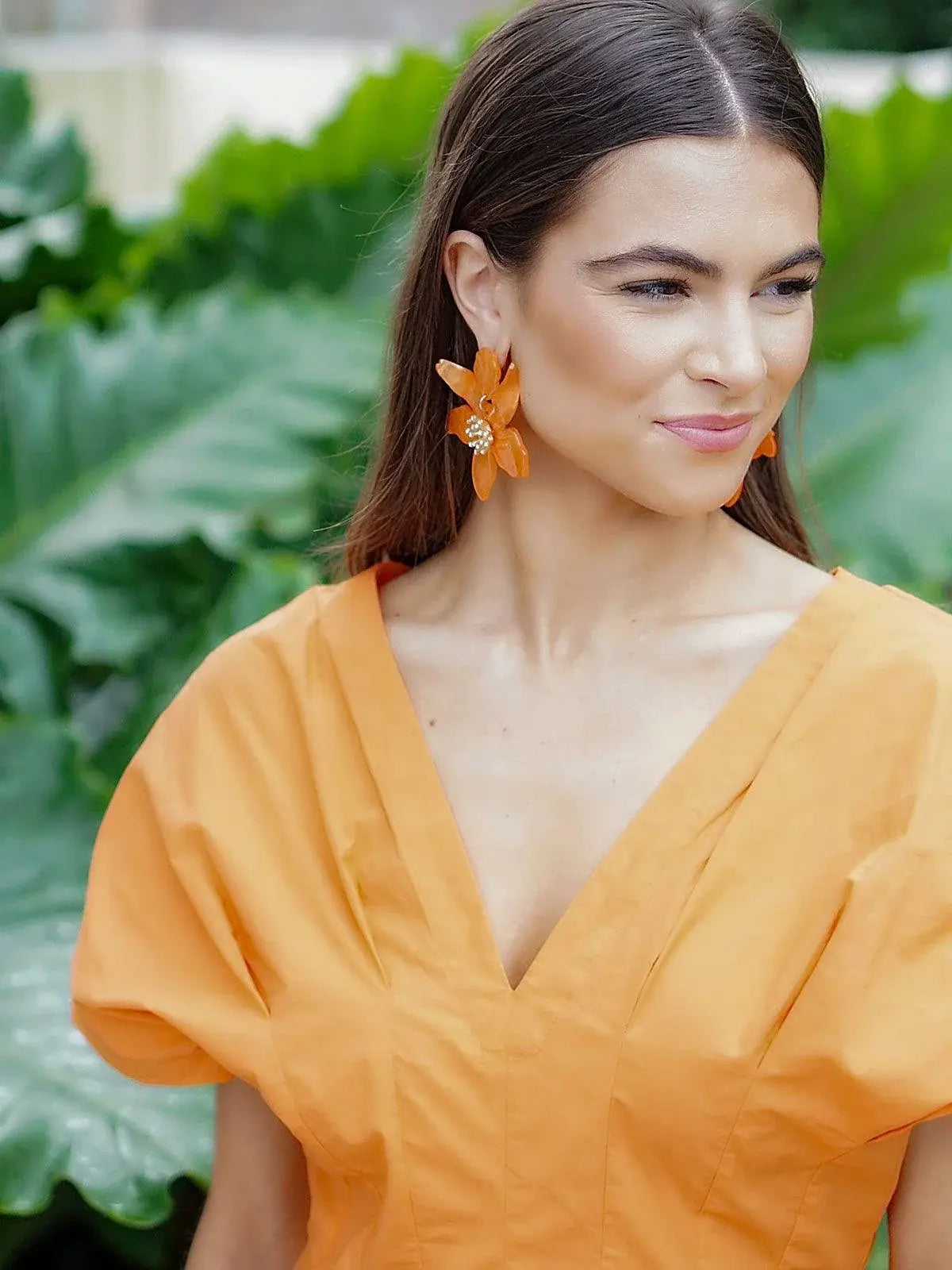 chloe resin flower statement earrings in orange