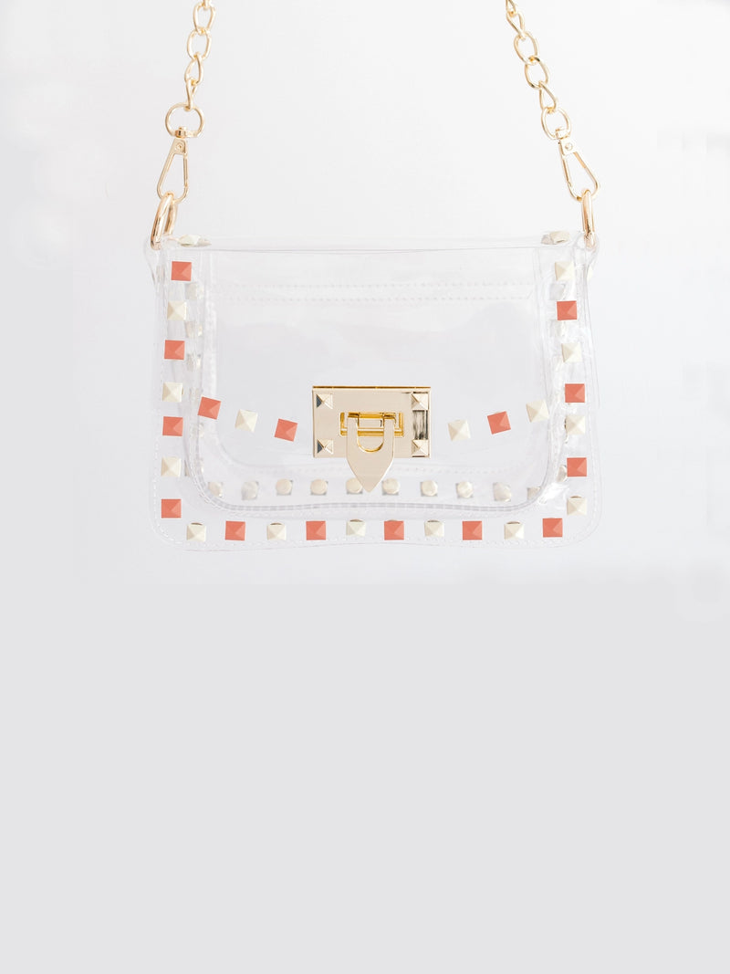 clearly handbags jackie clear stadium approved bag in orange and white with gold chain strap