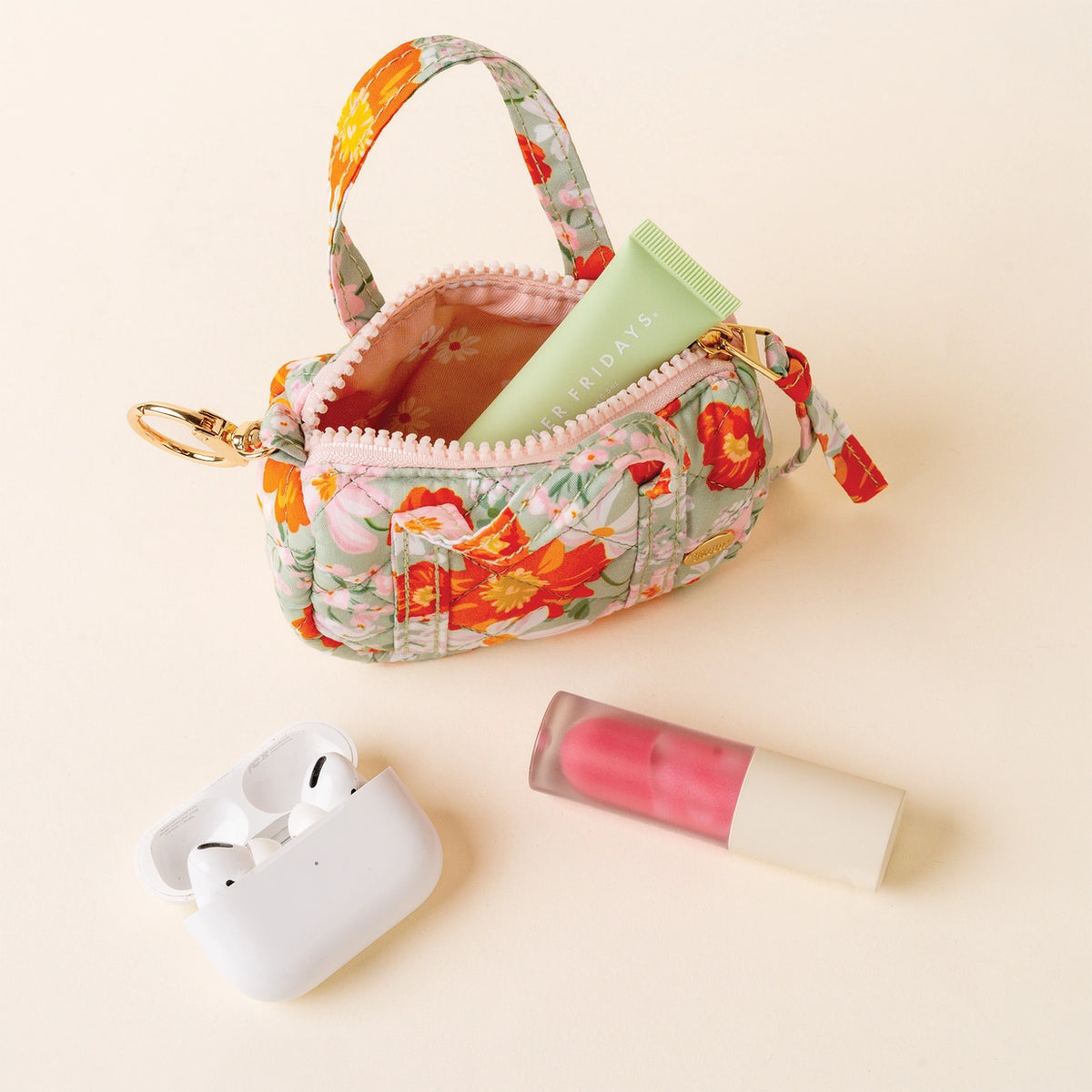 Green Orange Pink Floral Mini Duffle Bag Bag Charm Open with items next to it on Cream Background Darling Effect Itty Bitty Duffle Bag Charm Bouquet Beauty Sage