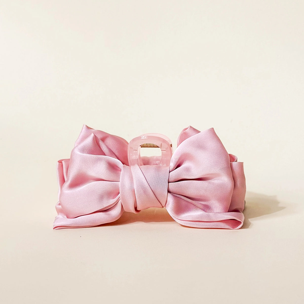 pink claw clip hair bow on cream background Darling Effect Satin Bow Claw Hair Clip Blush