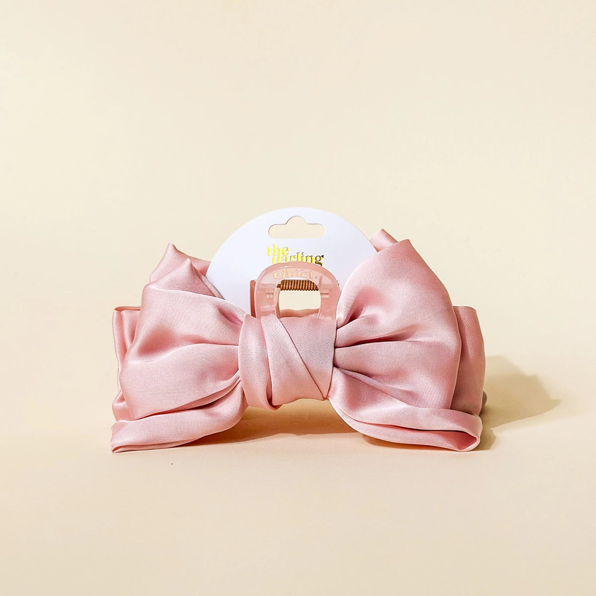 pink claw clip hair bow on cream background Darling Effect Satin Bow Claw Hair Clip Blush