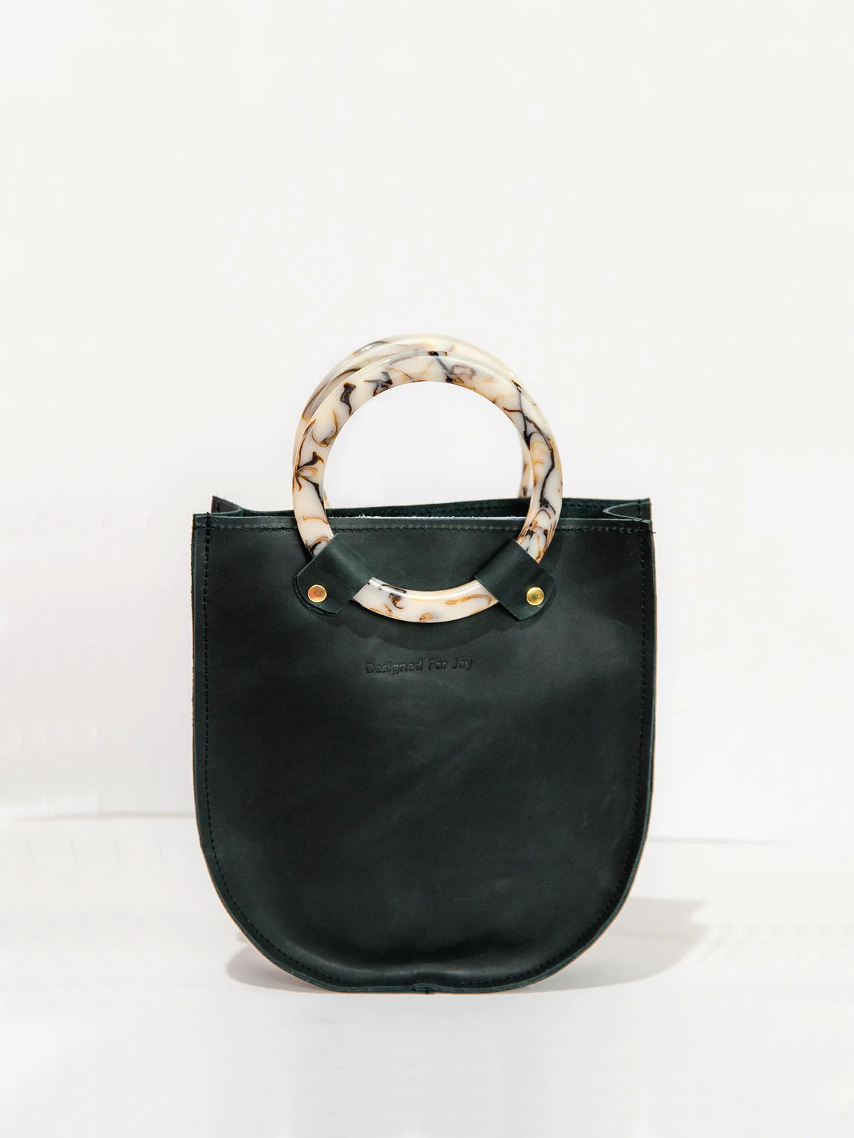designed for joy lottie ring handle tote bag in black leather