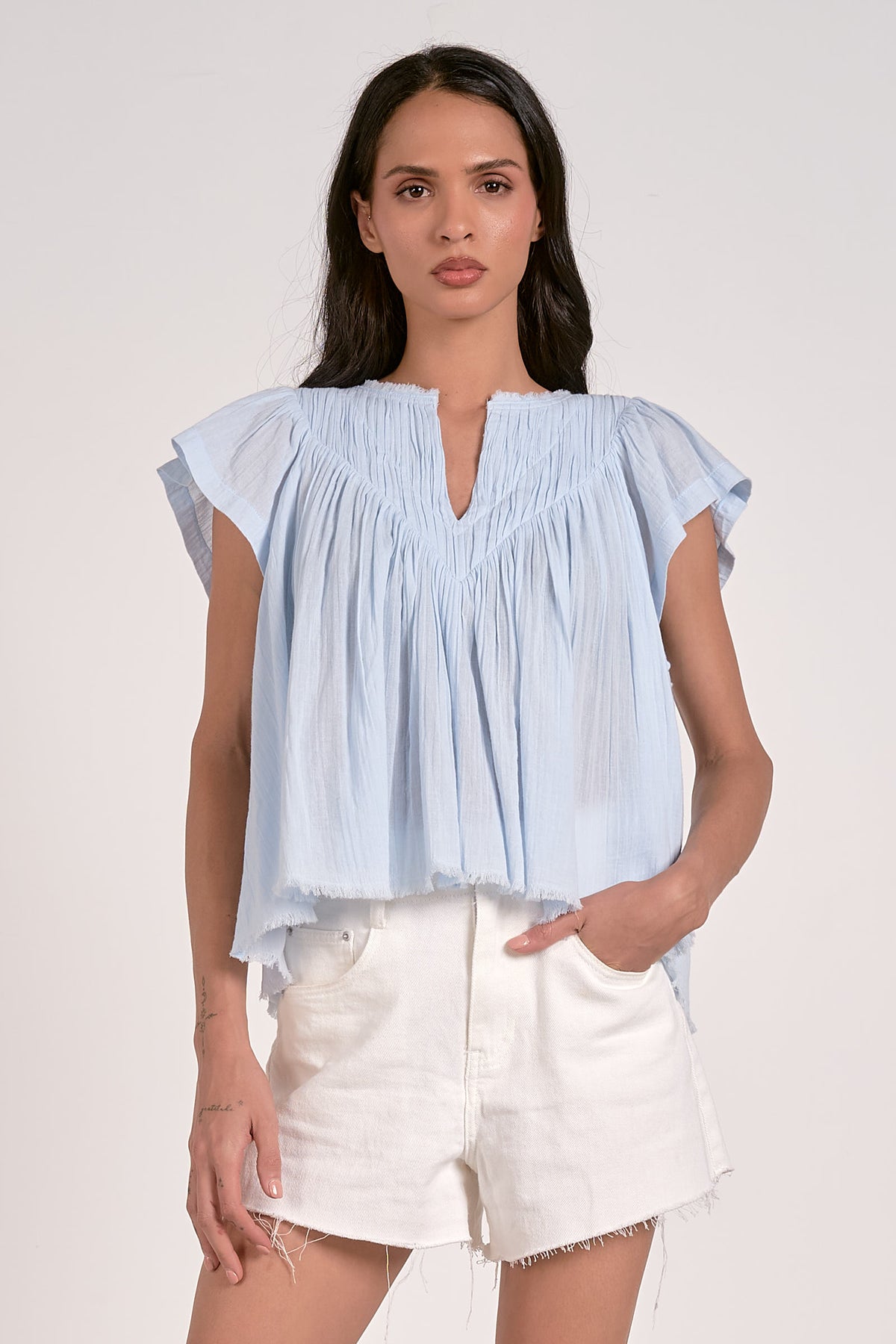 elan solid fray hem short sleeve top in light blue 