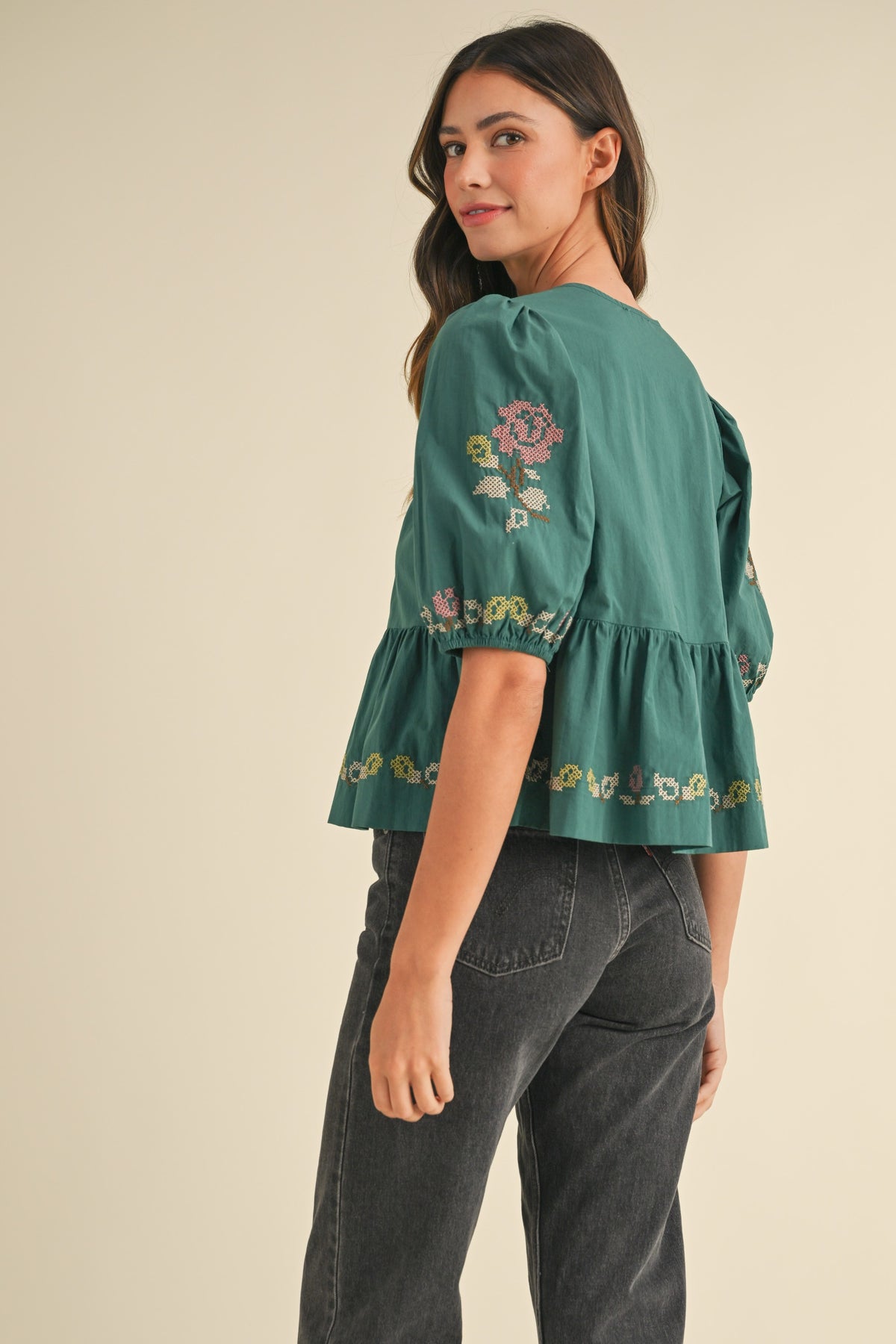 embroidered puff sleeve tie front peplum top in hunter green-back