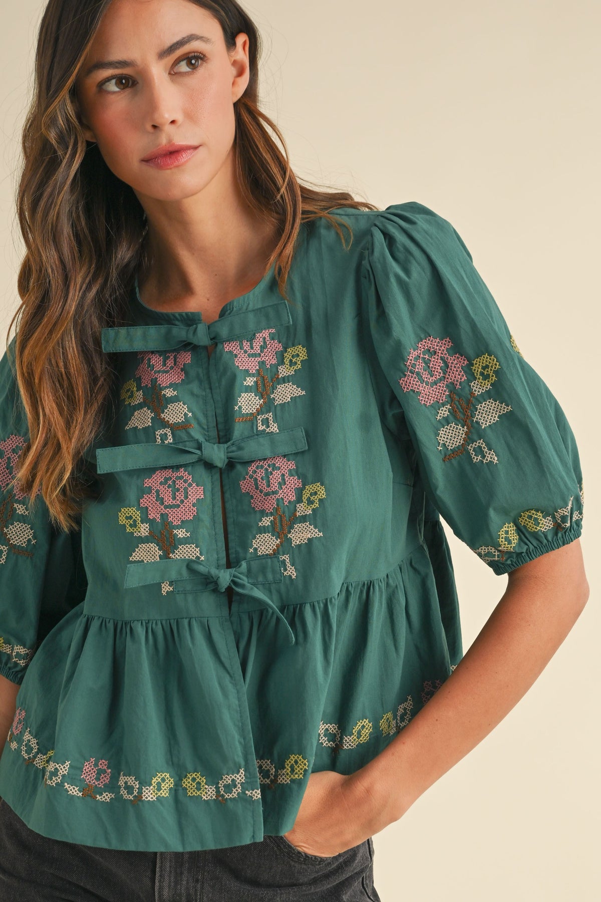 embroidered puff sleeve tie front peplum top in hunter green-front