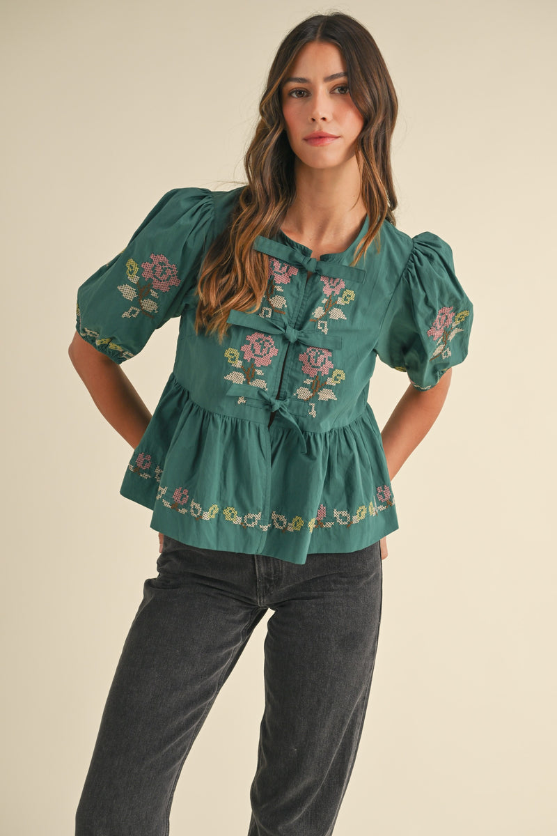 embroidered puff sleeve tie front peplum top in hunter green-front