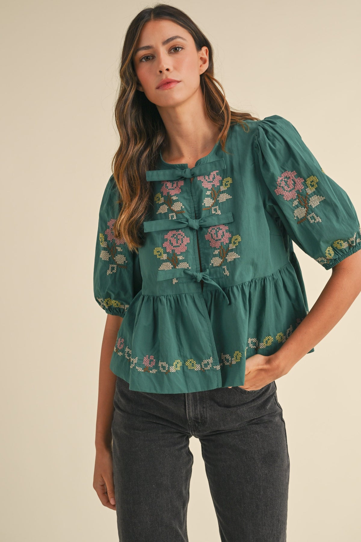 embroidered puff sleeve tie front peplum top in hunter green-front