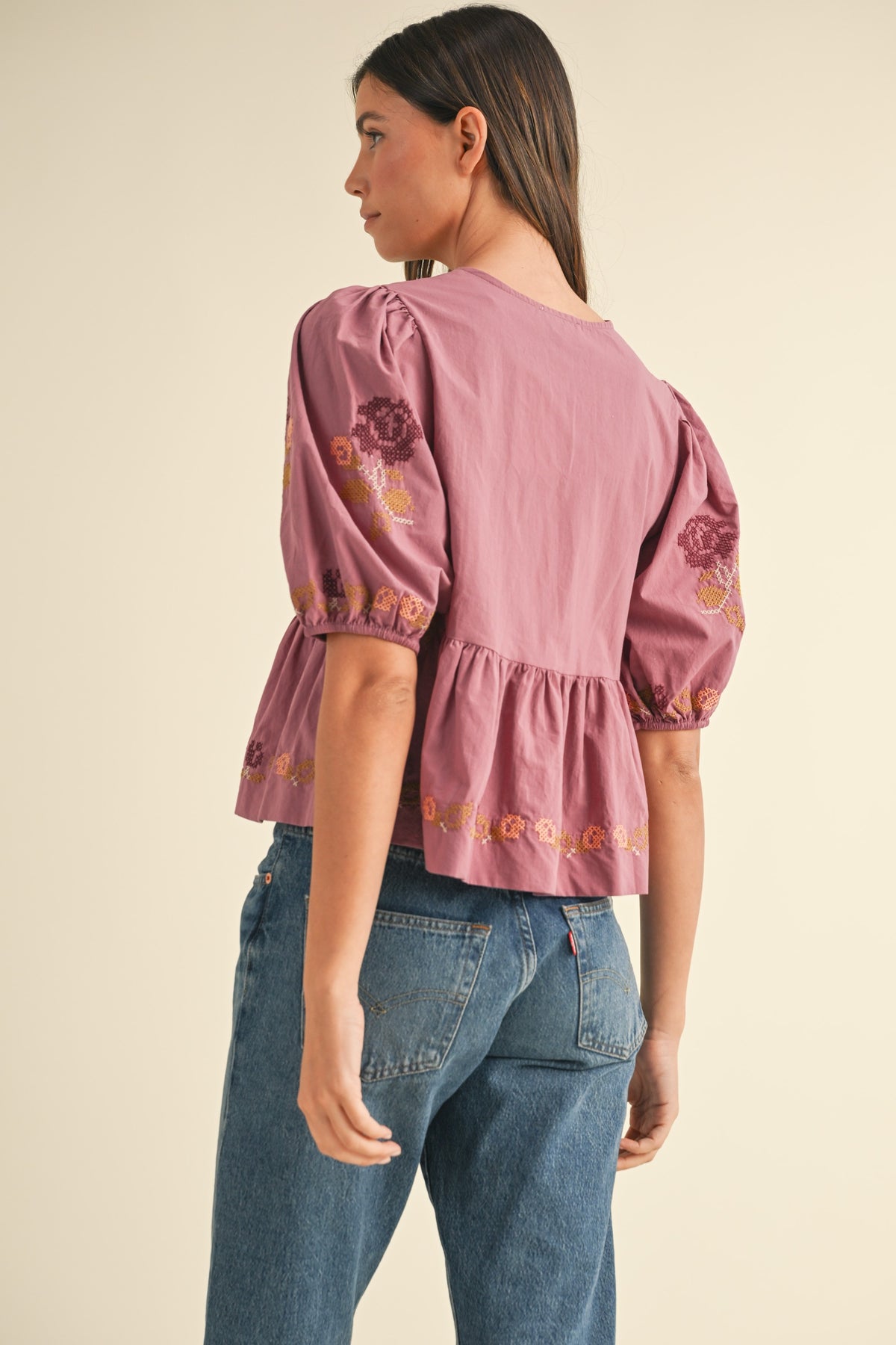 embroidered puff sleeve tie front peplum top in raspberry-back