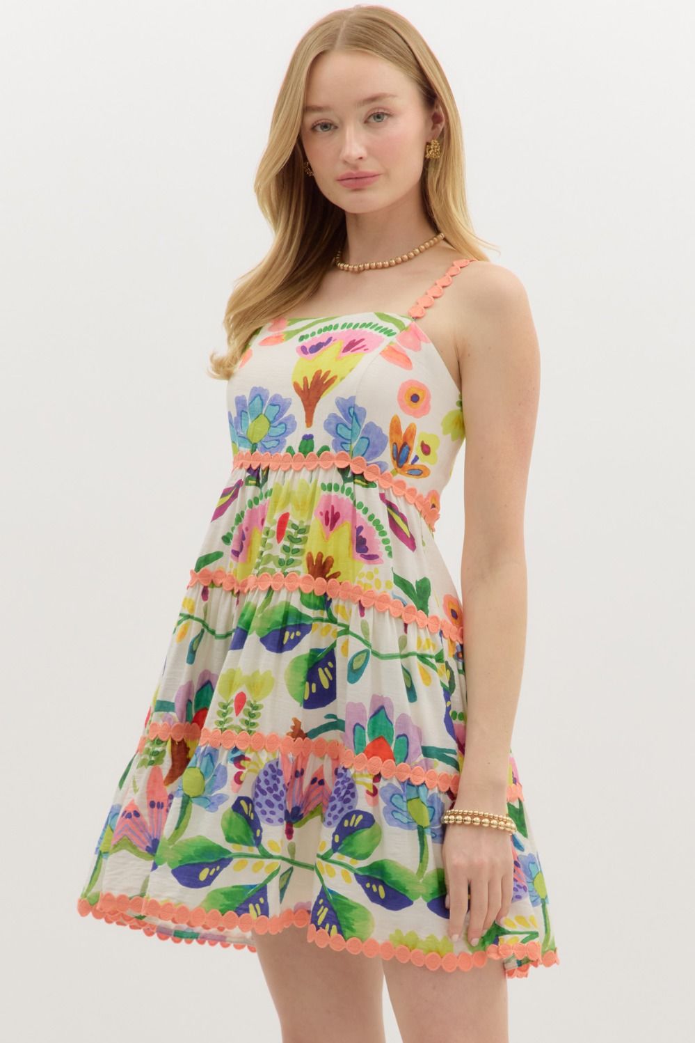 Botanical print trim accented adjustable shoulder strap pullover tiered mini dress in peach green