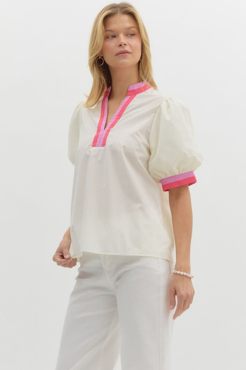 Solid short bubble sleeve top featuring multicolor band finish in white and pink