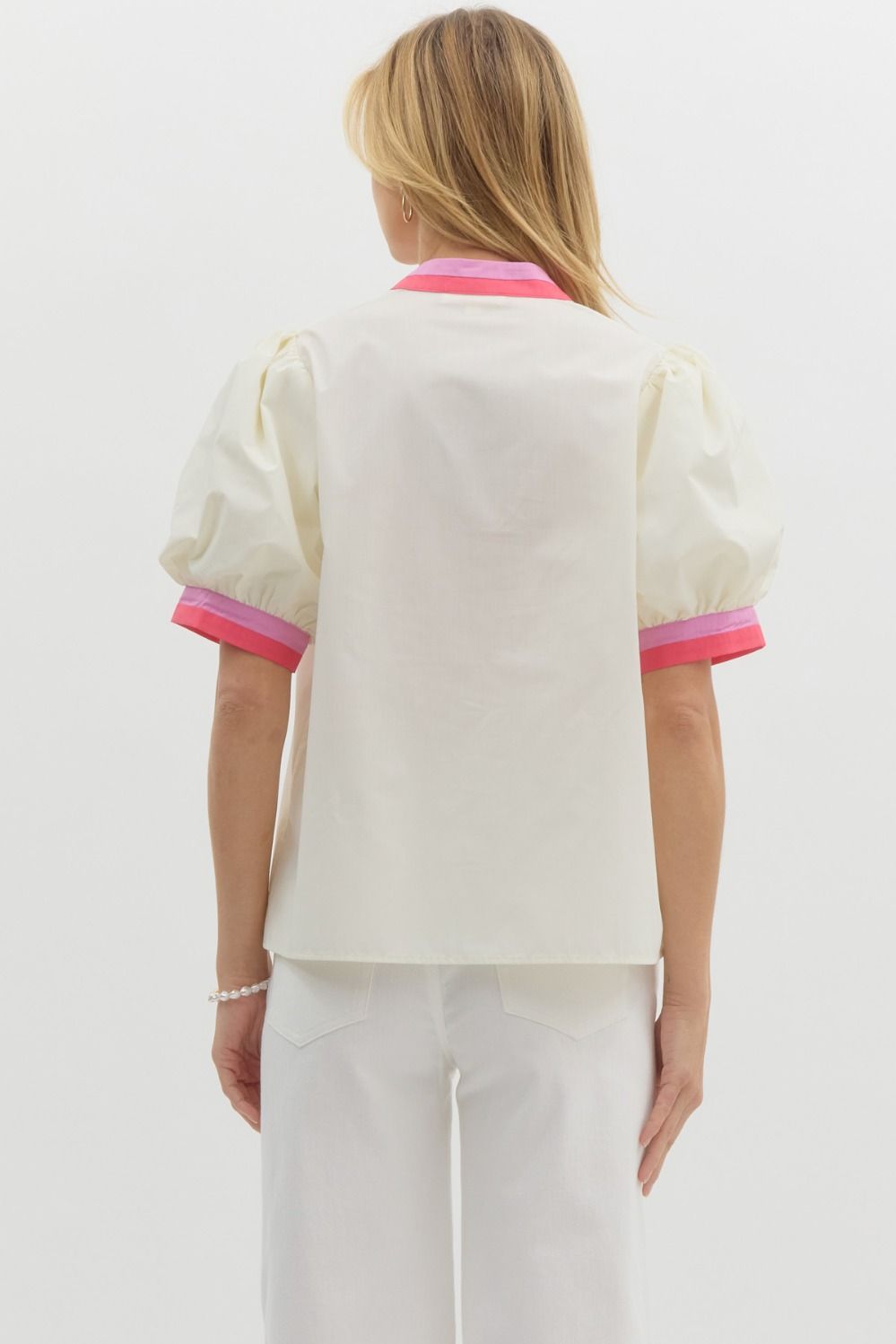 Solid short bubble sleeve top featuring multicolor band finish in white and pink