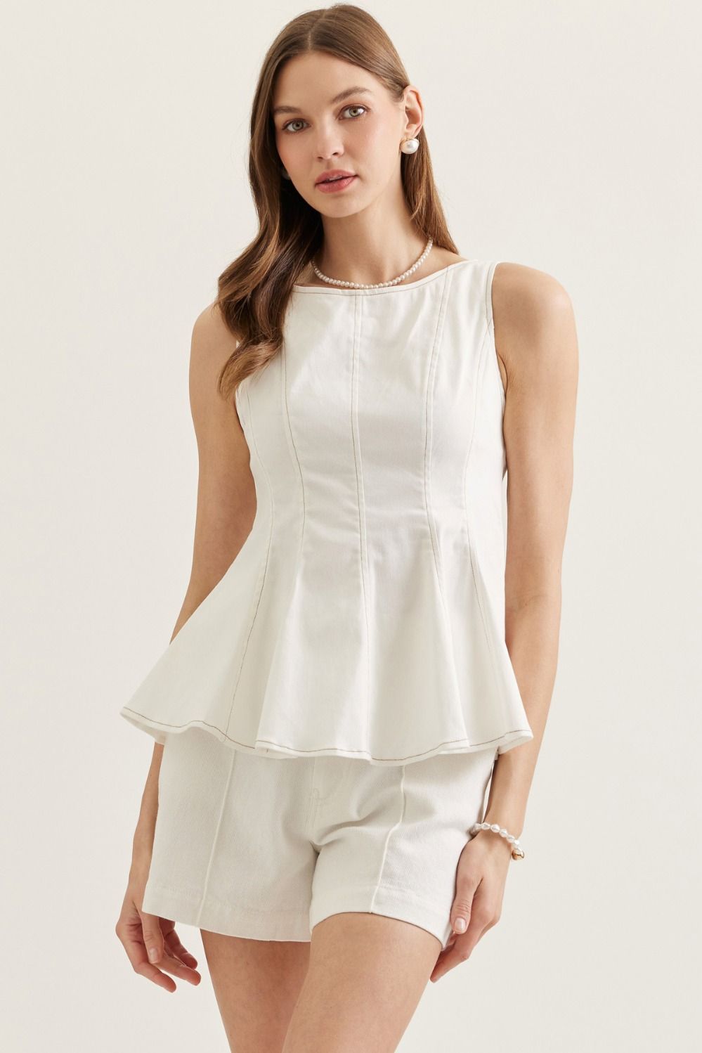Seamed Sleek Sleeveless Peplum Top