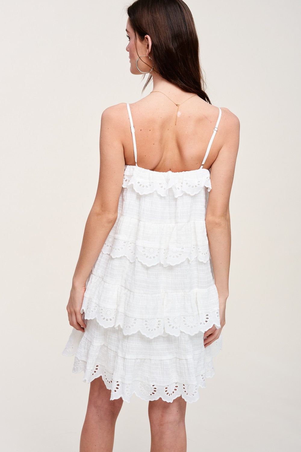 eyelet edge ruffle mini dress in white-back