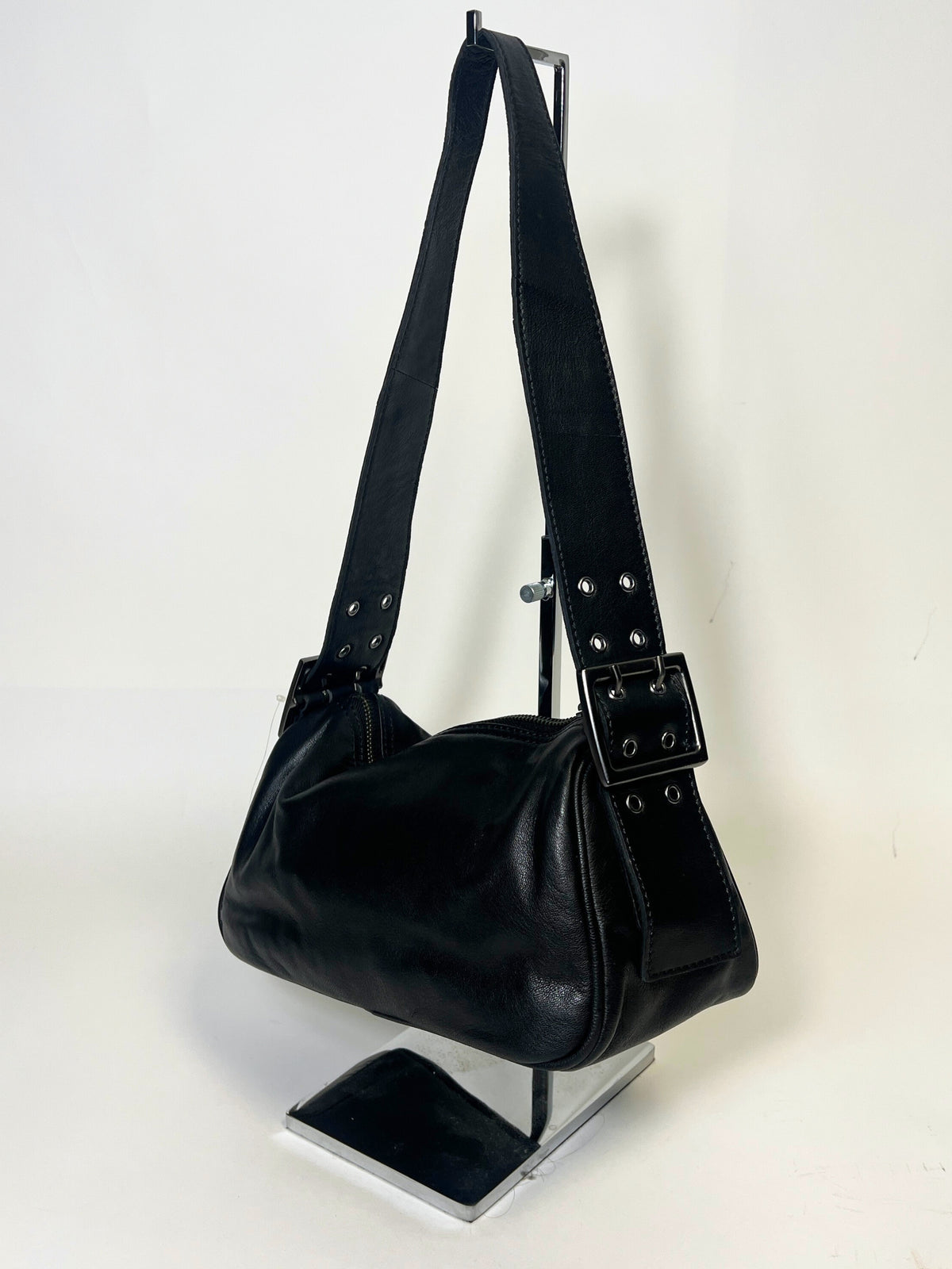 Free people Black leather handbag with a strap on a white background