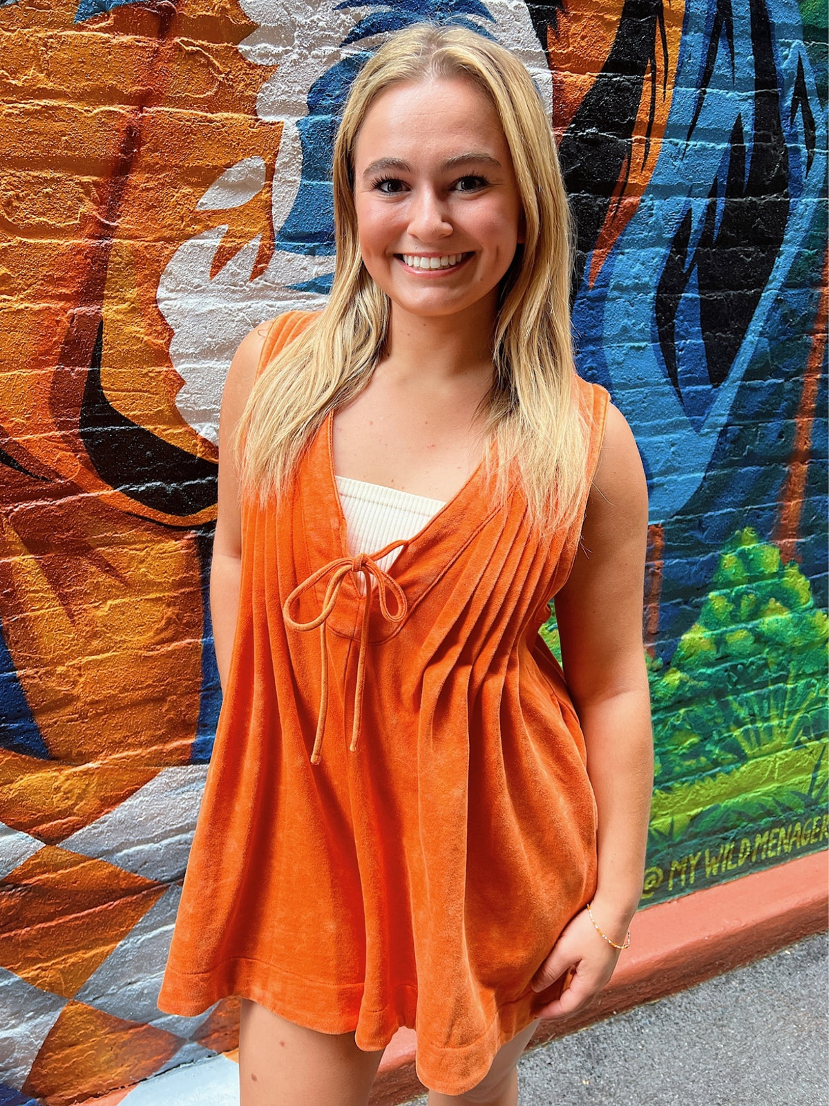 french terry sleeveless v neck romper in orange model