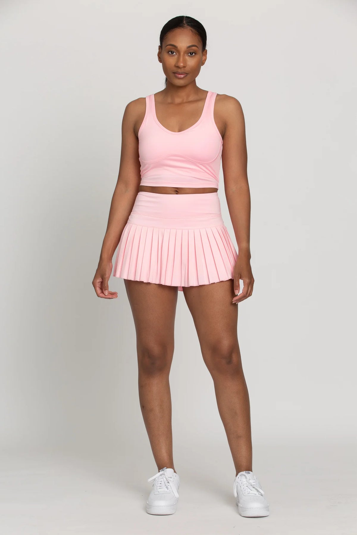 gold hinge pleated tennis skirt in baby pink
