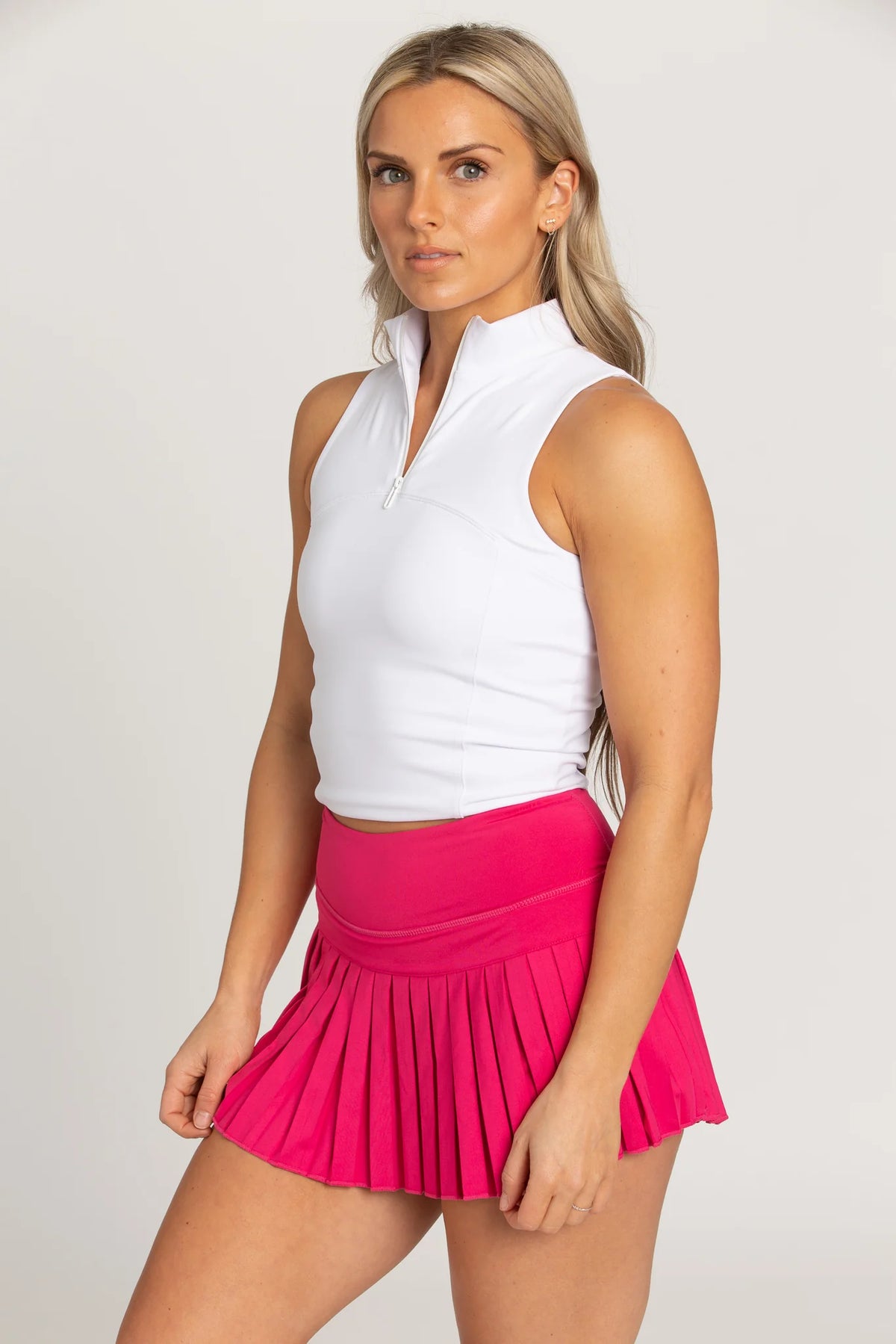 gold hinge pleated tennis skirt in hot pink