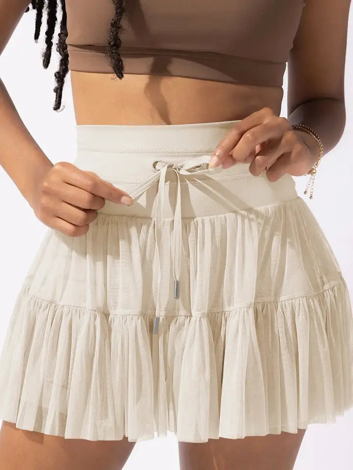 high waisted lace up paneled pleated skirt in apricot-front