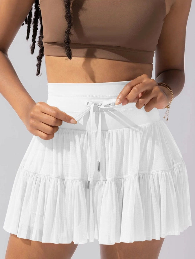 high waisted lace up paneled pleated skirt in white-front