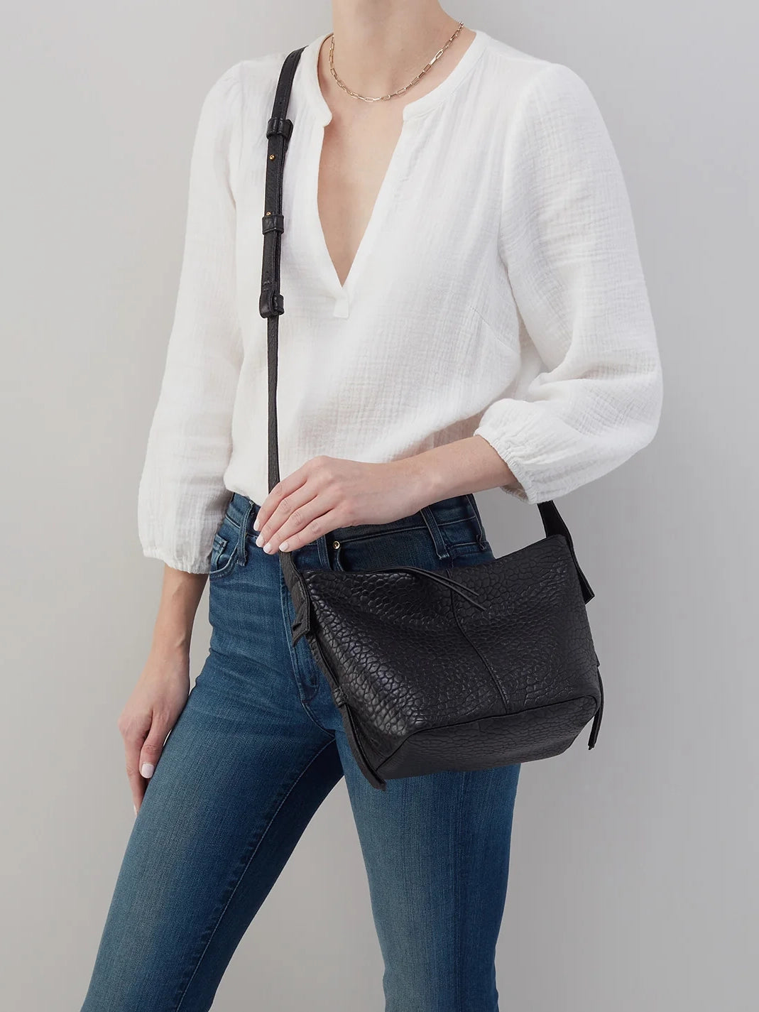 hobo bonita crossbody bag in black bubble pebbled leather