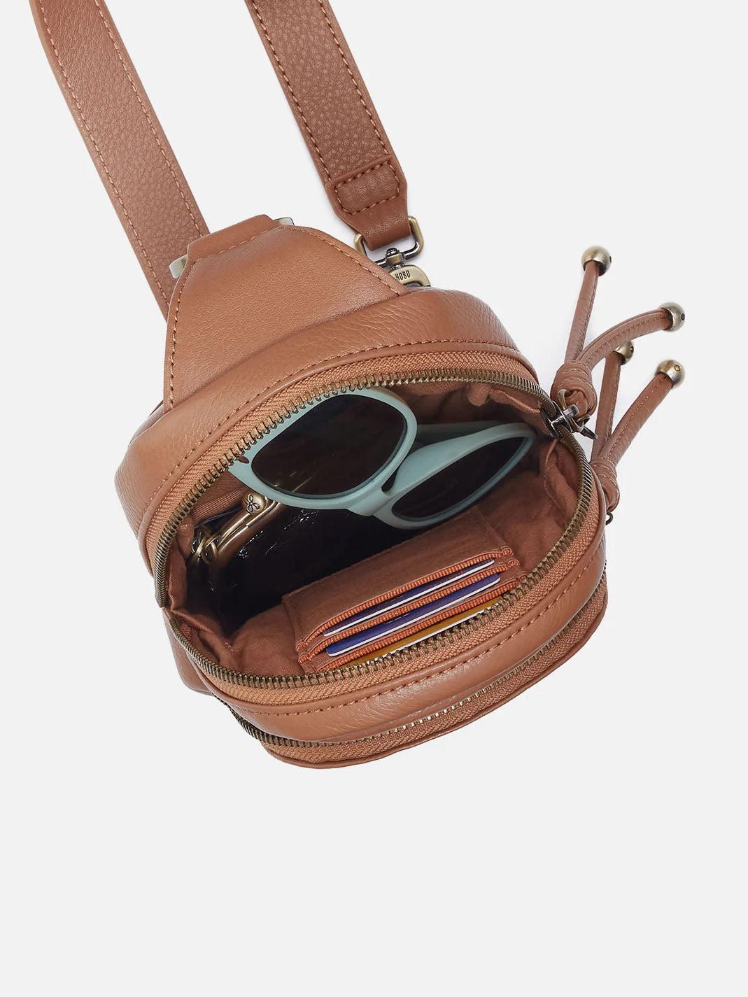 HOBO Cass Small Pebbled Leather Sling in Brown Sugar