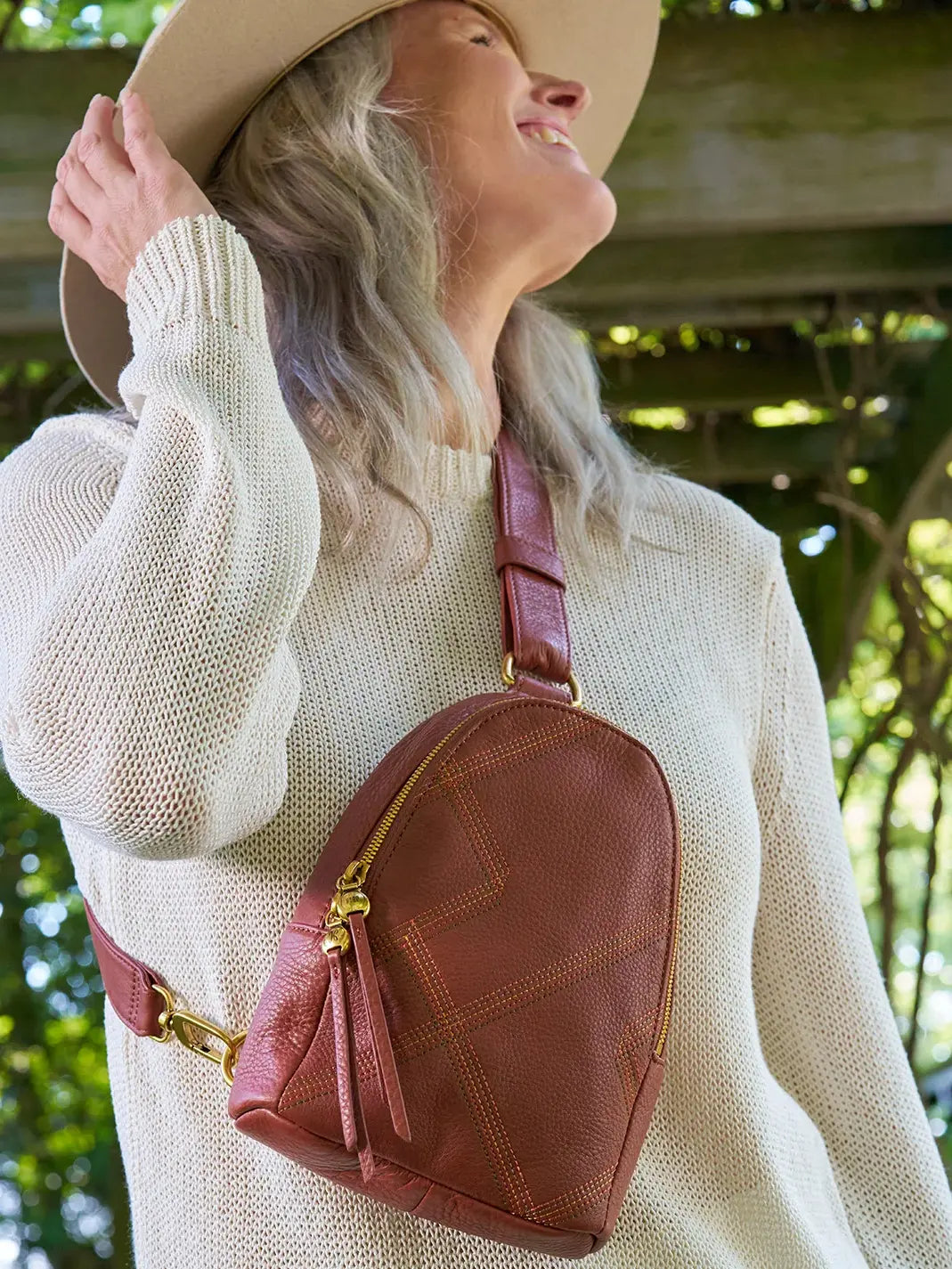 HOBO Fern Pebbled Leather Stitched Sling Bag in Rust