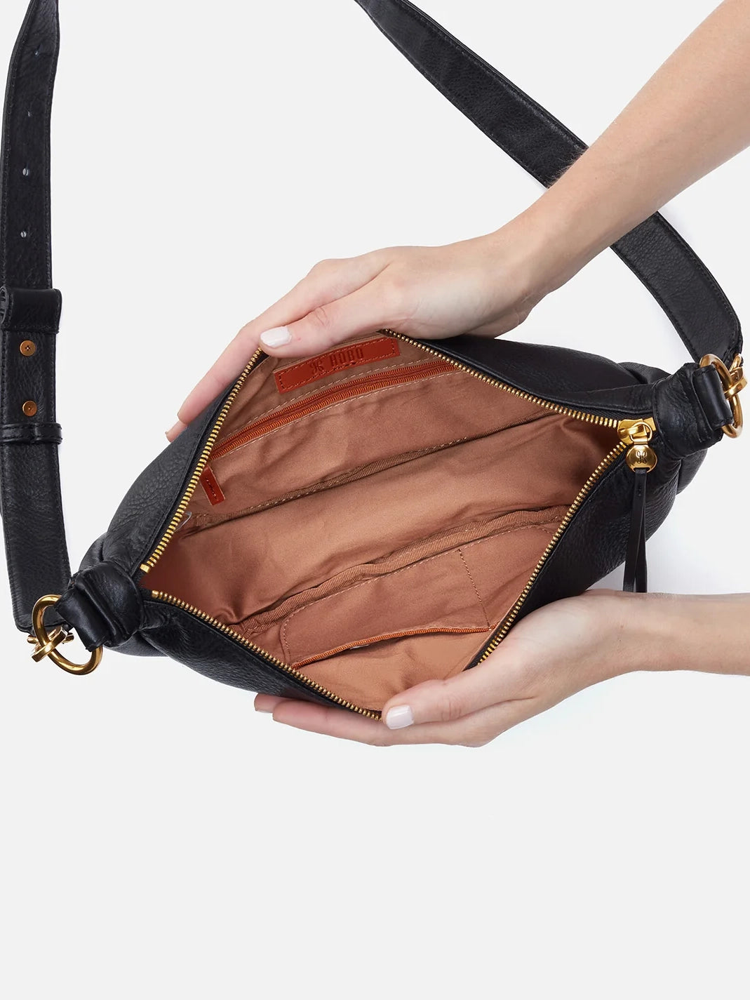 hobo knox sling bag in black pebbled leather