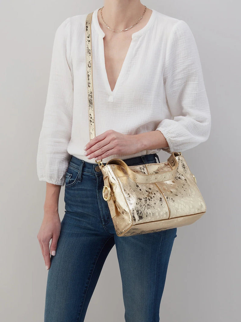 hobo render small crossbody bag in gilded gold metallic leather