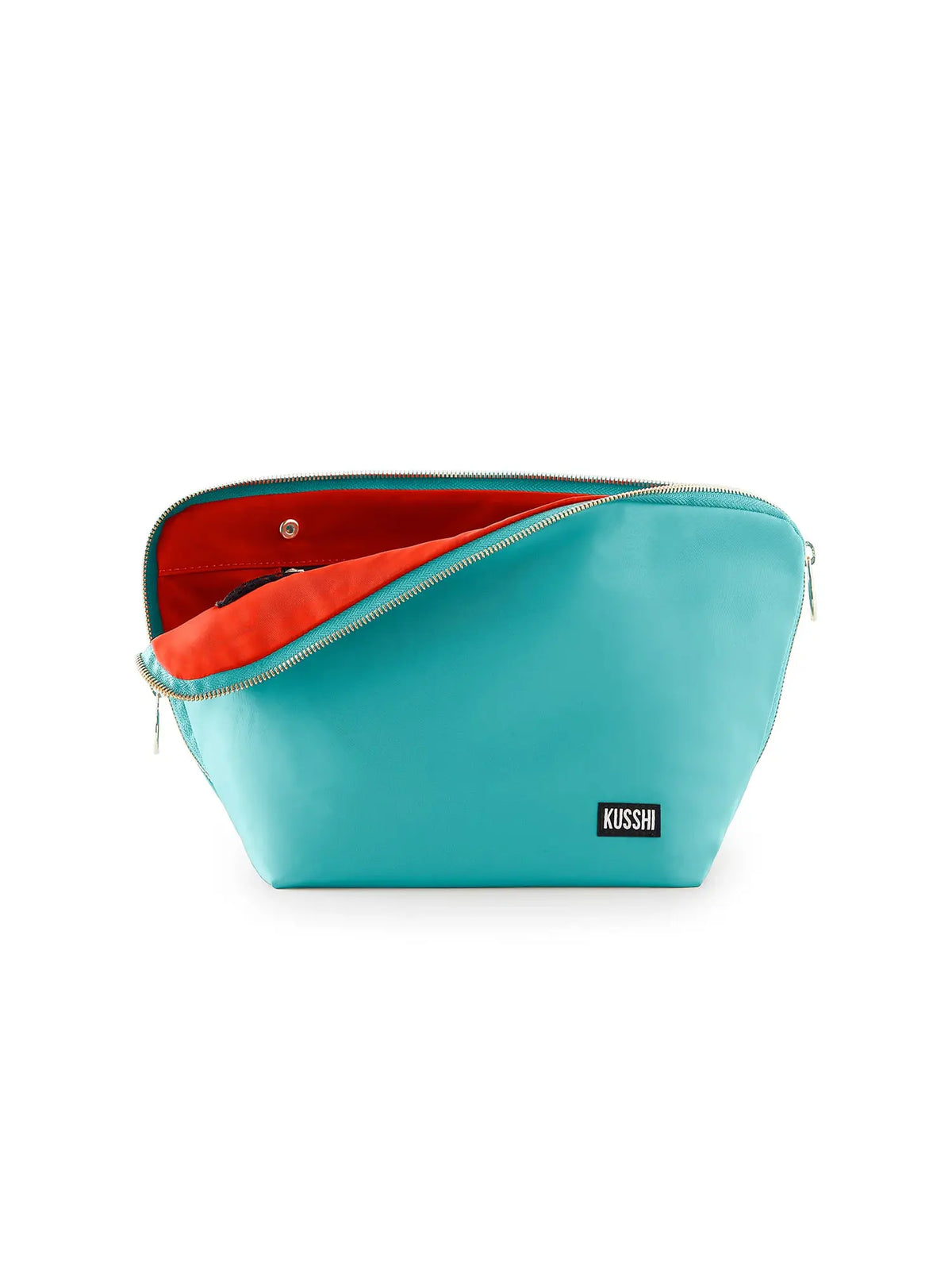 kusshi fabric vacationer makeup bag in sea green with bright orange lining