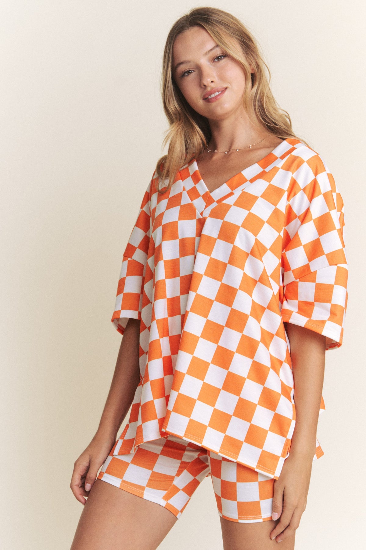 orange and white checkerboard top and biker shorts-front