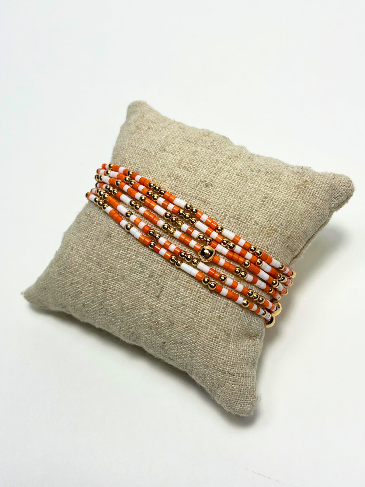 Orange and White Beaded Bracelet Stack