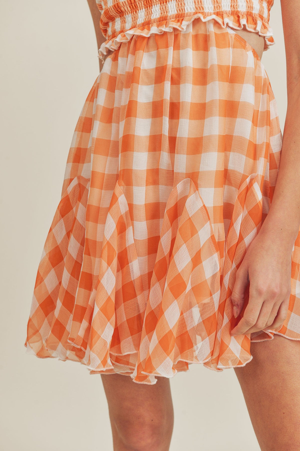 tennessee orange gingham smocked top ruffle bottom cutout detail dress in orange-bottom detail
