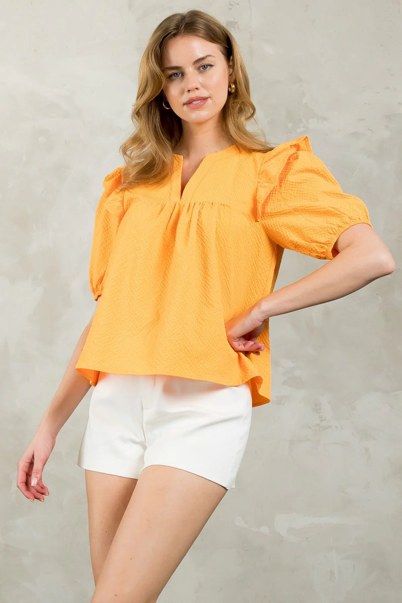 tennessee orange puff sleeve textured top in orange-side