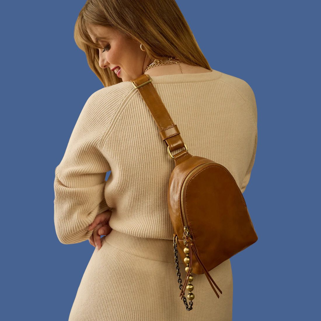 Shop Winter Handbags, Wallets & Accessories at Bliss Knoxville. HOBO Fern Polished Leather Sling Bag Truffle.