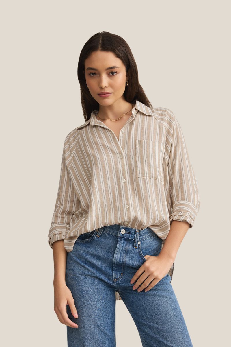 shop spring clothing from z supply at bliss knoxville model in striped linen button down top on taupe background