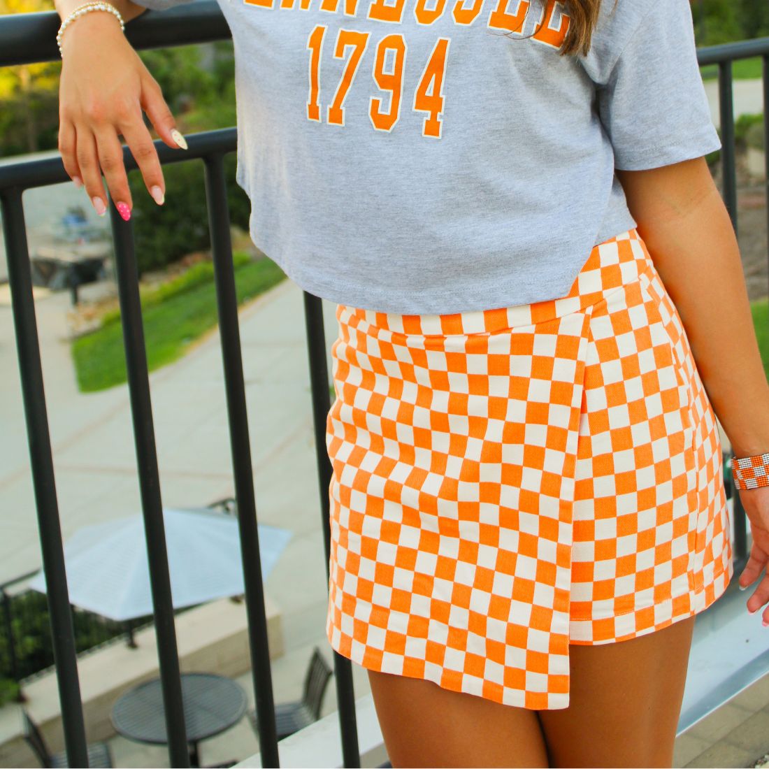 Shop Tennessee Volunteers Gameday Bottoms, Skirts, Shorts, Skorts at Bliss Knoxville. TN Vols Gameday Fashion Clothing for Women. Orange & White Checkerboard Denim Mini Skort.