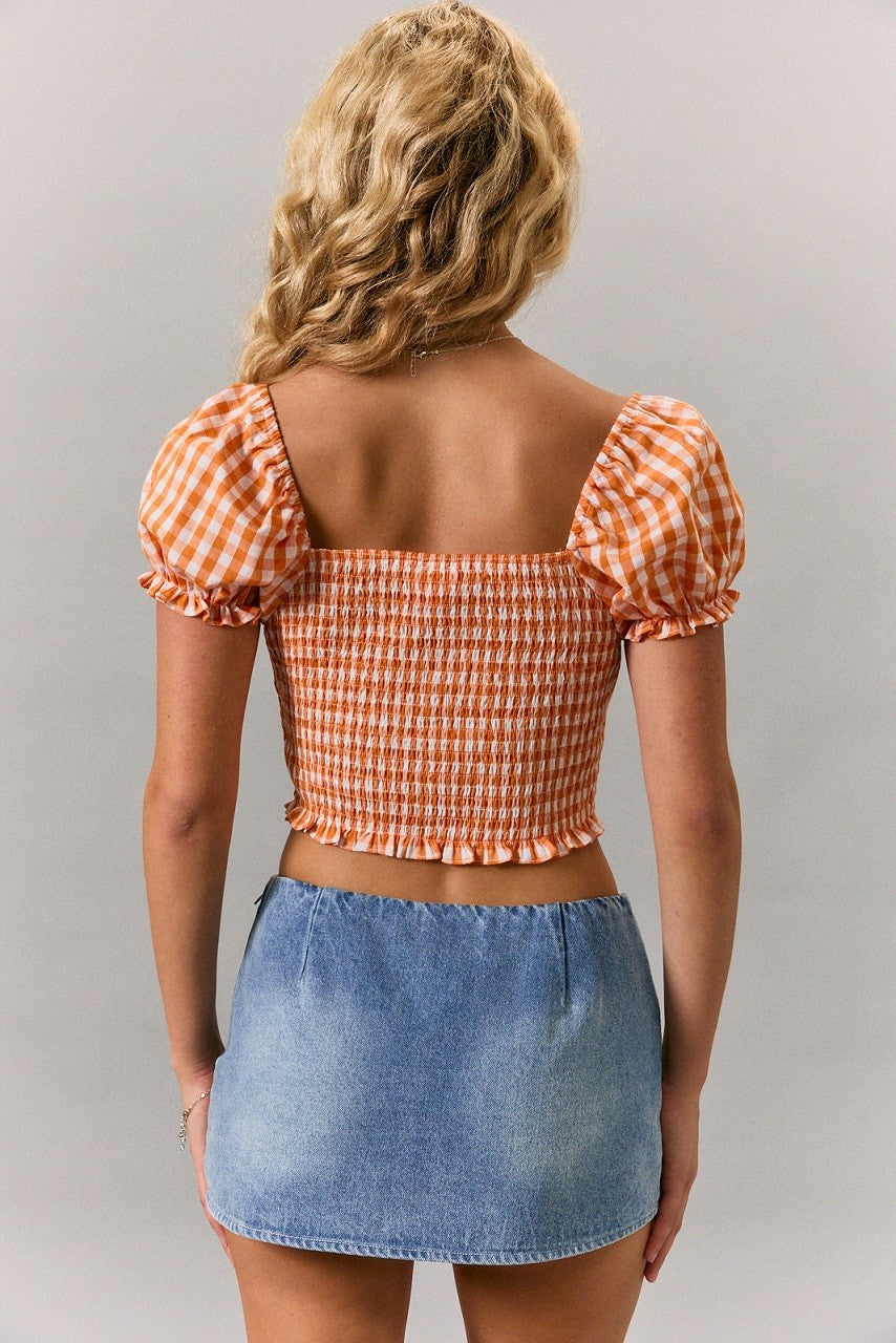 short puff sleeve gingham top with tie front in orange white checkerboard