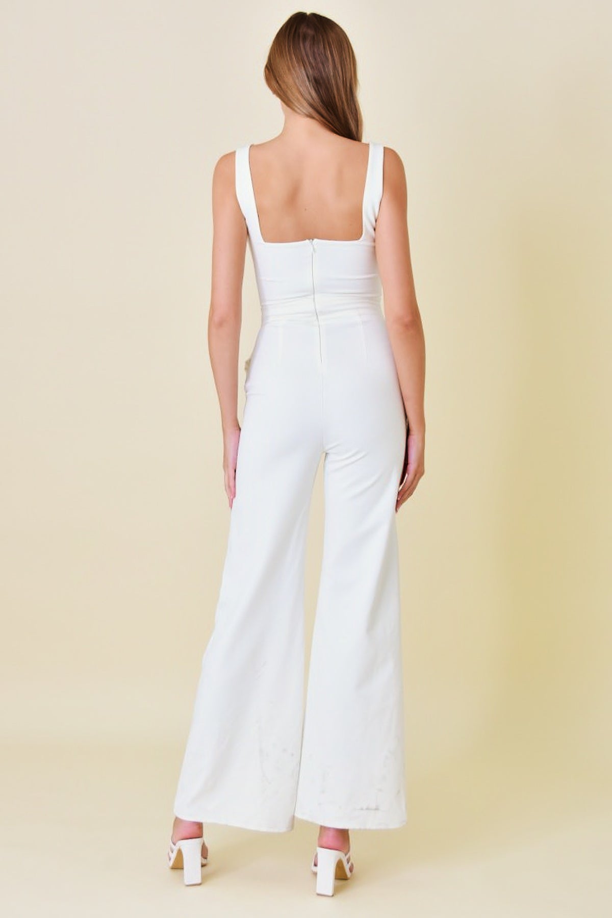 sleeveless fitted jumpsuit with pockets in ivory-back