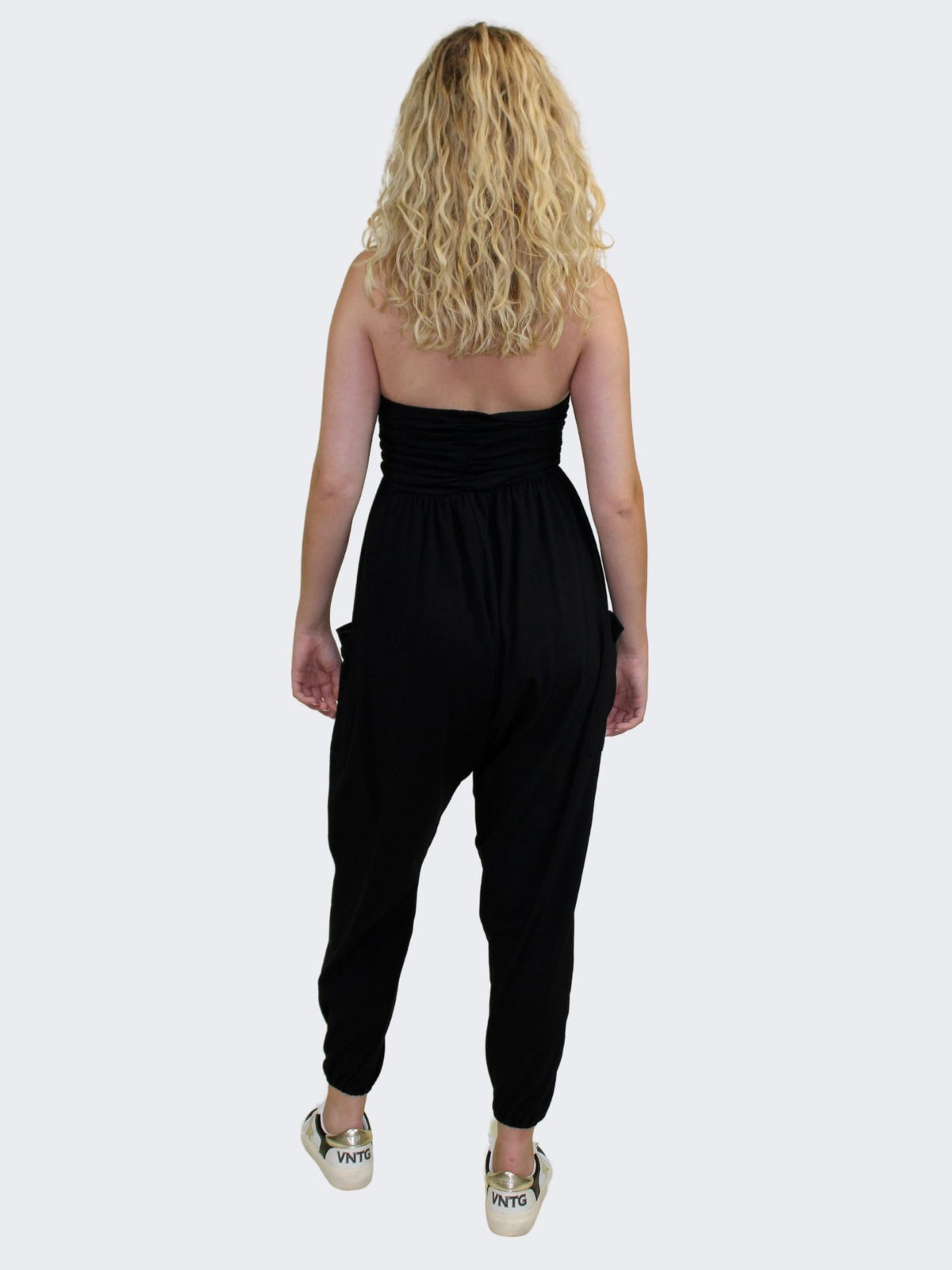 black strapless ruched jogger jumpsuit with pockets